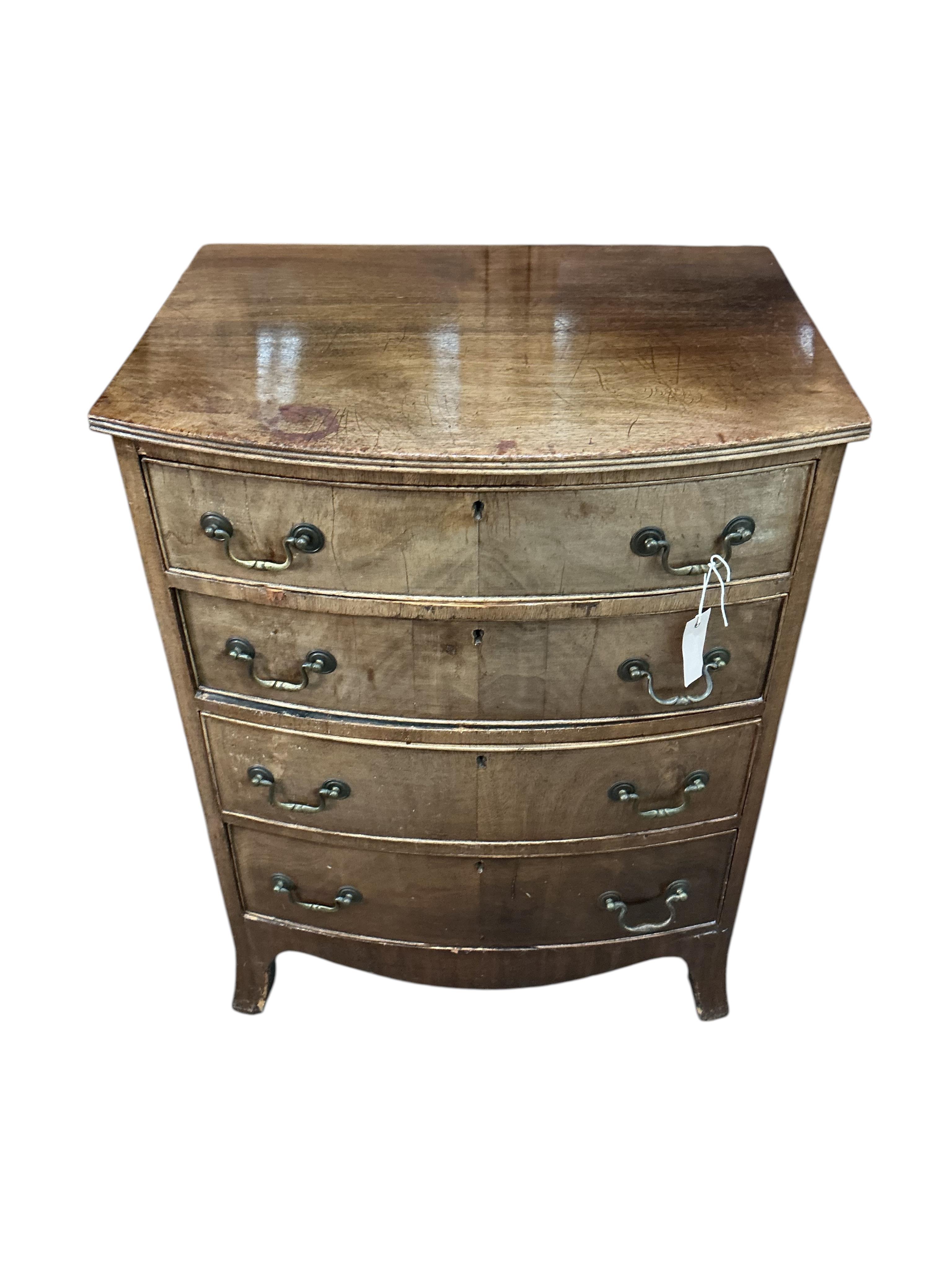 A small Regency style bow front four drawer mahogany chest, width 64cm, depth 48cm, height 84cm